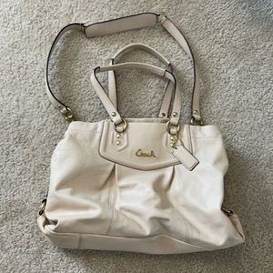 Genuine Coach leather bag in cream with gold hardware.
